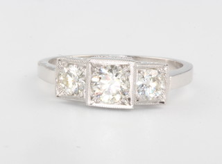 A platinum 3 stone diamond ring, approx. 0.95ct, size O 