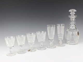 A Waterford Crystal club shaped panel cut decanter together with 2 matching champagne flutes, 2 wine glasses and 2 sherry glasses 