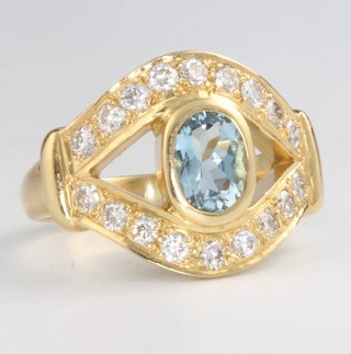 An 18ct yellow gold topaz and diamond ring size R, 12.5 grams