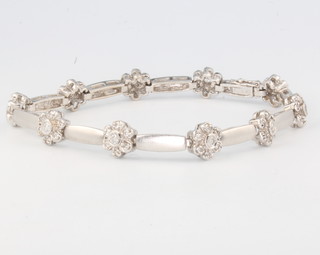 An 18ct white gold diamond set floral bracelet, 16.6 grams, 175mm 