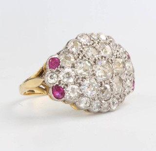 An 18ct yellow gold diamond and ruby ring set with brilliant cut diamonds, size P 1/2