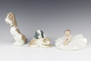 A Nao figure of a seated ballerina 18cm, ditto group of 2 puppies 12cm and 1 other seated dog 17cm 