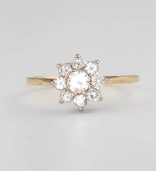 An 18ct yellow gold diamond cluster ring size L 