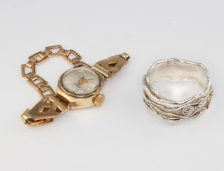 A lady's 9ct yellow gold Swiss Empress wristwatch on an unmarked gold strap together with a silver ring, size Q 