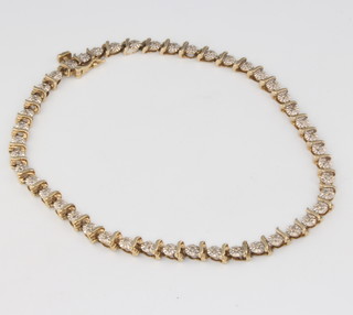 A 9ct yellow gold diamond line bracelet, 6.4 grams, 205mm