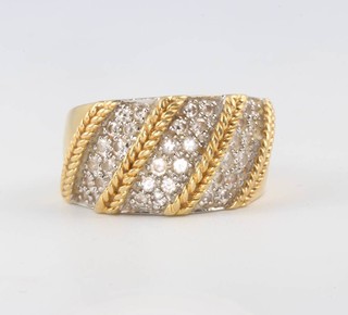 An 18ct yellow gold diamond whorl ring 10.4 grams, size M 1/2