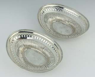 A pair of Victorian pierced silver oval bon bon dishes, London 1891, 17cm, 228 grams 