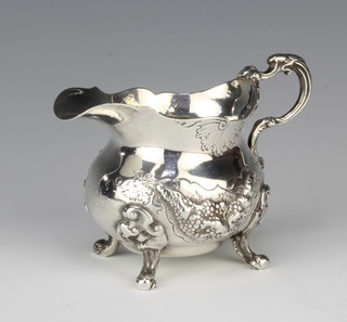 A Victorian cast silver cream jug of baluster form with S scroll handle on scroll feet, London 1839, maker possibly Samuel Godbehere  236 grams