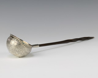 A Georgian silver toddy ladle with coin set base and whalebone handle 34cm 