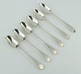 A set of 6 George III bright cut silver tea spoons, rubbed marks 92 grams