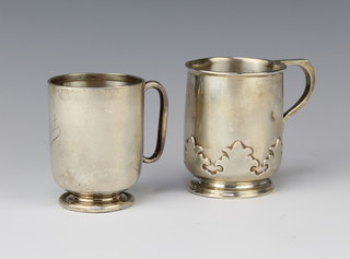 A silver mug with S scroll handle, Sheffield 1924, a small ditto Birmingham 1919, 227 grams 