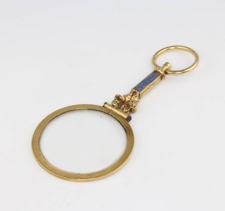 An Edwardian gilt and enamel eye glass 8cm in a fitted case 