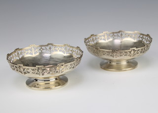 A pair of circular silver bon bon dishes with pierced rims Birmingham 1919, 11 cm, 165 grams