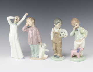 4 Nao figures of children -standing boy stretching, boy with football, boy with telephone teddybear and boy with teddy bear 