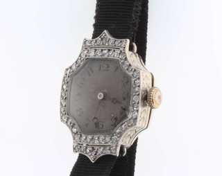 A lady's Art Deco platinum and diamond wristwatch on a silk strap 
