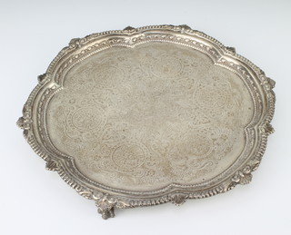 A Victorian silver salver with fancy scroll rim on claw feet, London 1897, 29 cm, 550 grams