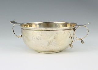 A silver quaich with simple wing handles and engraved monogram 16cm, 115 grams 