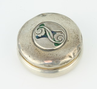 Liberty and Co, a Cymric silver and enamelled circular trinket box with enamelled decoration, Birmingham 1904, 6cm, 32 grams 