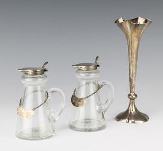 2 silver mounted whisky bottles with labels Birmingham 1937, 10cm, together with a silver spill vase 