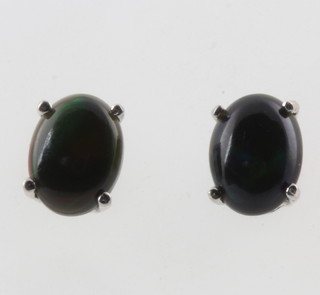 A pair of black Ethiopian opal ear studs