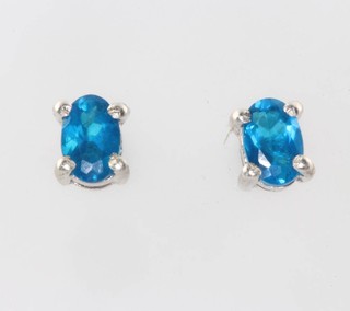 A pair of neon apatite ear studs 1.2ct 