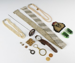A gilt eye glass and minor jewellery including a silver watch