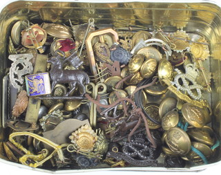 A quantity of Second World War and later cap badges and buttons