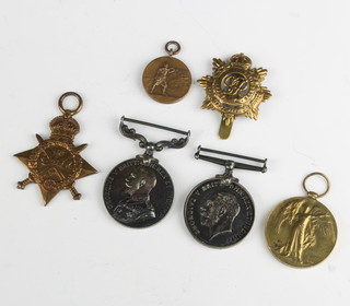 A World War One group of medals to T/26429 CPL.W.Spreadbury A.S.C. comprising 1914 Star, War medal, Victory medal and Long Service Good Conduct medal together with a cap badge