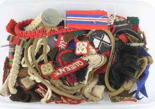 Two Second World War medals - British War medal and Italy Star and a quantity of cloth and other badges 