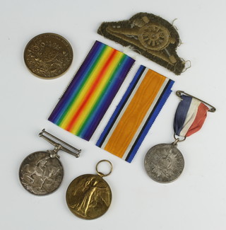 A World War One pair of medals to F.2359 A.W. Hayson P.O.M. R.N A.S, a school medallion, commemorative coin and cloth badge
