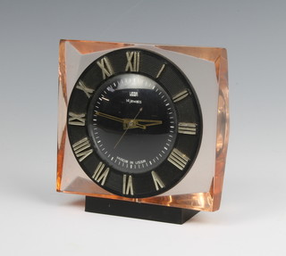 UEGA, a Soviet Russian mantel timepiece with black dial contained in a peach coloured Bakelite case 