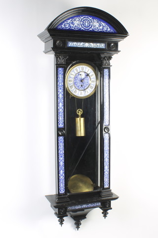 A Victorian regulator style wall clock with Roman numerals contained in an ebonised and blue enamel case with panel decoration