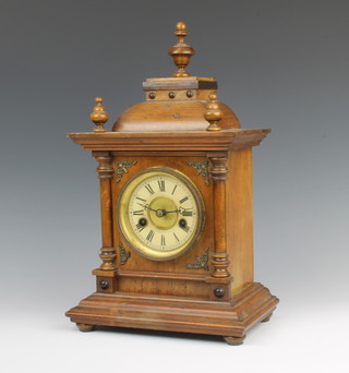 Hamburg American Clock Company, a 14 day striking mantel clock with paper dial and Roman numerals contained in a walnut case complete with pendulum (no key) 