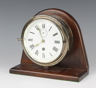 A ward room style clock with 14cm enamelled dial with Roman numerals and subsidiary second hand contained in a silver plated  case 