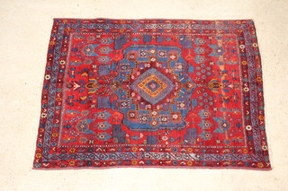 A red and blue ground Persian Afshar rug with central medallion 208cm x 150cm 