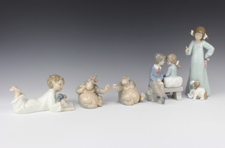 Five Nao figures - standing girl with dog 23cm, boy and girl seated on a bench in conversation 15cm, boy reading with puppy 19cm and 2 seated apes 8cm 