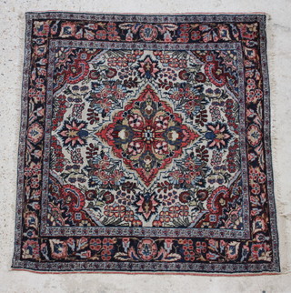 A blue and white ground Persian rug with central medallion 100cm x 107cm 