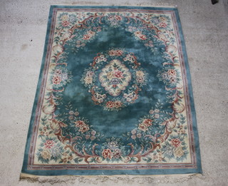 A green and floral patterned Chinese carpet 310cm x 245cm 