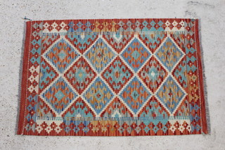 A Choli multicoloured Kilim rug with diamond decoration to the centre 122cm x 82cm 