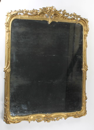 A rectangular plate mirror contained in a gilt plaster frame 93cm x 72cm 