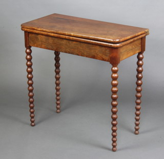 A 19th Century Continental bleached mahogany card table raised on bobbin turned supports 76cm x 80cm x 40cm 