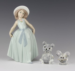 A Lladro figure of a standing girl 18cm, a Swarovski figure of a bear 2.5cm (chip to body), ditto mouse 4cm 