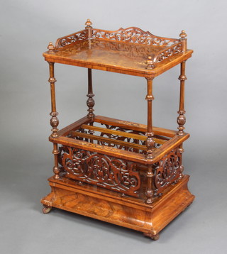 A Victorian inlaid figured walnut what-not Canterbury the upper section with pierced 3/4 gallery and quarter veneered top, the base fitted a 3 section Canterbury and secret drawer raised on ceramic casters 90cm x 60cm x 39cm 