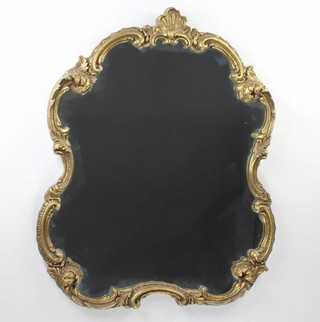A Rococo style shaped mirror contained in a decorative gilt frame 75cm x 61cm 