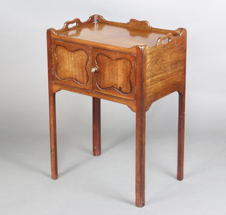 A Georgian style mahogany tray top commode enclosed by a pair of panelled doors, raised on square tapered supports 76cm h x 53cm w x 38cm d 