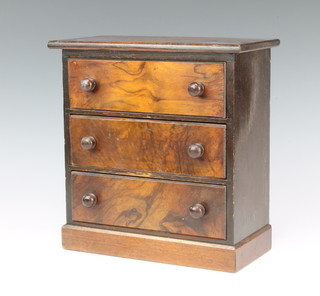 A Victorian walnut "apprentice" chest of 3 drawers raised on a platform base 26cm h x 25cm w x 12cm d