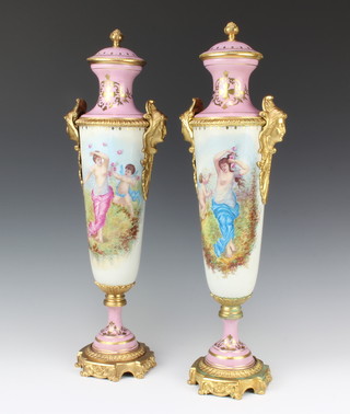A pair of Sevres style pink porcelain twin handled urn and covers with gilt metal mounts 54cm 