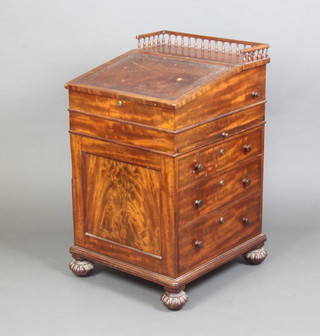 A William IV mahogany Davenport with 3/4 gallery and sliding top the pedestal fitted an ink drawer and brushing slide and 3 drawers, raised on turned supports with Bramah lock 84cm x 50cm x 55cm 