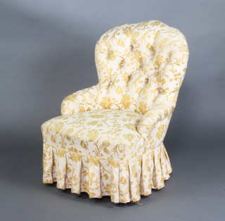 A Victorian tub back nursing chair upholstered in yellow buttoned material 