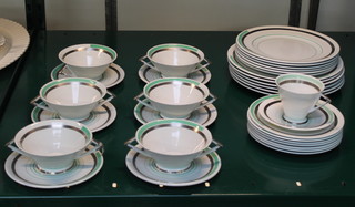 A 1930's 33 piece Shelley Eve pattern, shaped dinner service, comprising 6 twin handled soup bowls and 6 saucers, 6 dinner plates, 6 breakfast plates, 7 tea plates,  tea cup and saucer 

